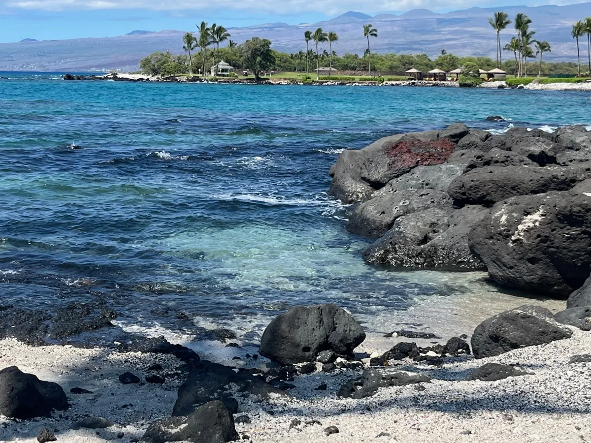 Rocky Hawaiian coastline with crystal blue water