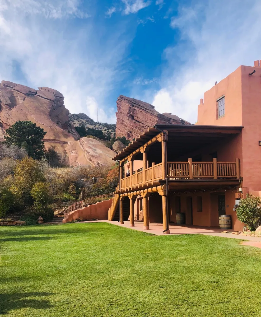 Lodge nestled against red rock formations